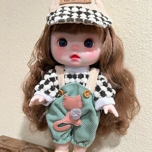 Charming Doll with Green Overalls and Cap